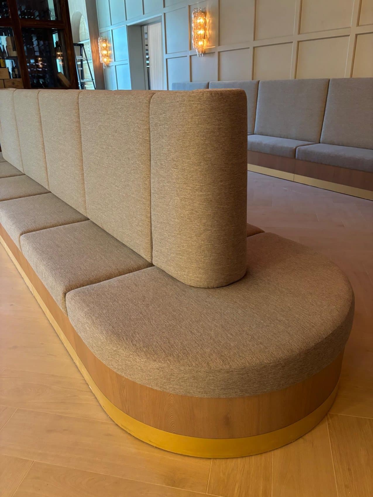 Curved banquette, gold trim